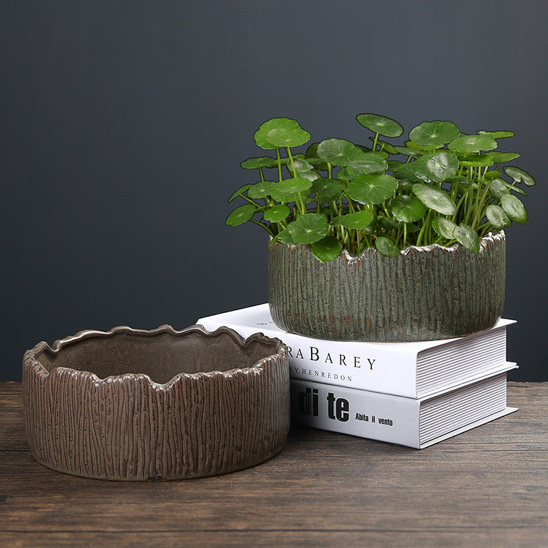 Handcrafted ceramic planter styled in a rustic lifestyle setting with natural decor