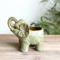 Rear view of the sculptural elephant ceramic planter highlighting the textured glaze and hollow back