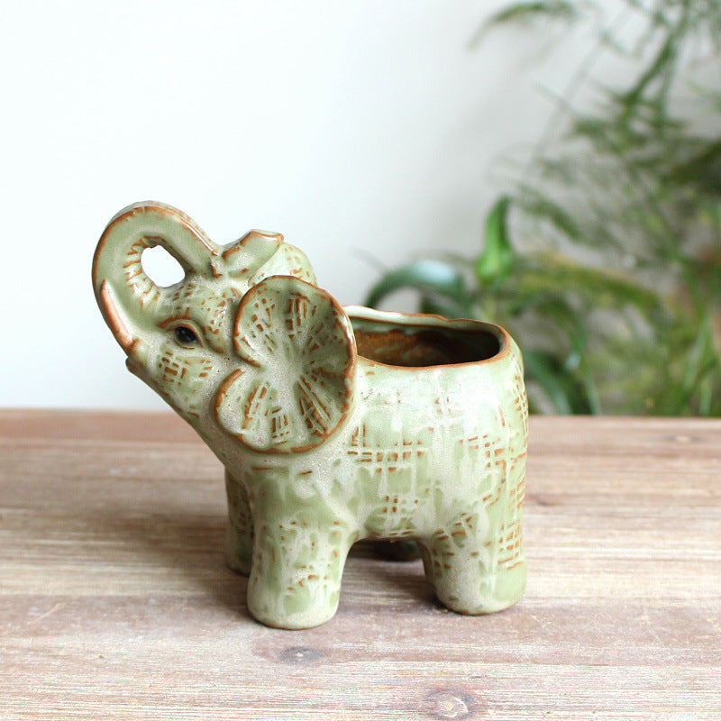 Rear view of the sculptural elephant ceramic planter highlighting the textured glaze and hollow back
