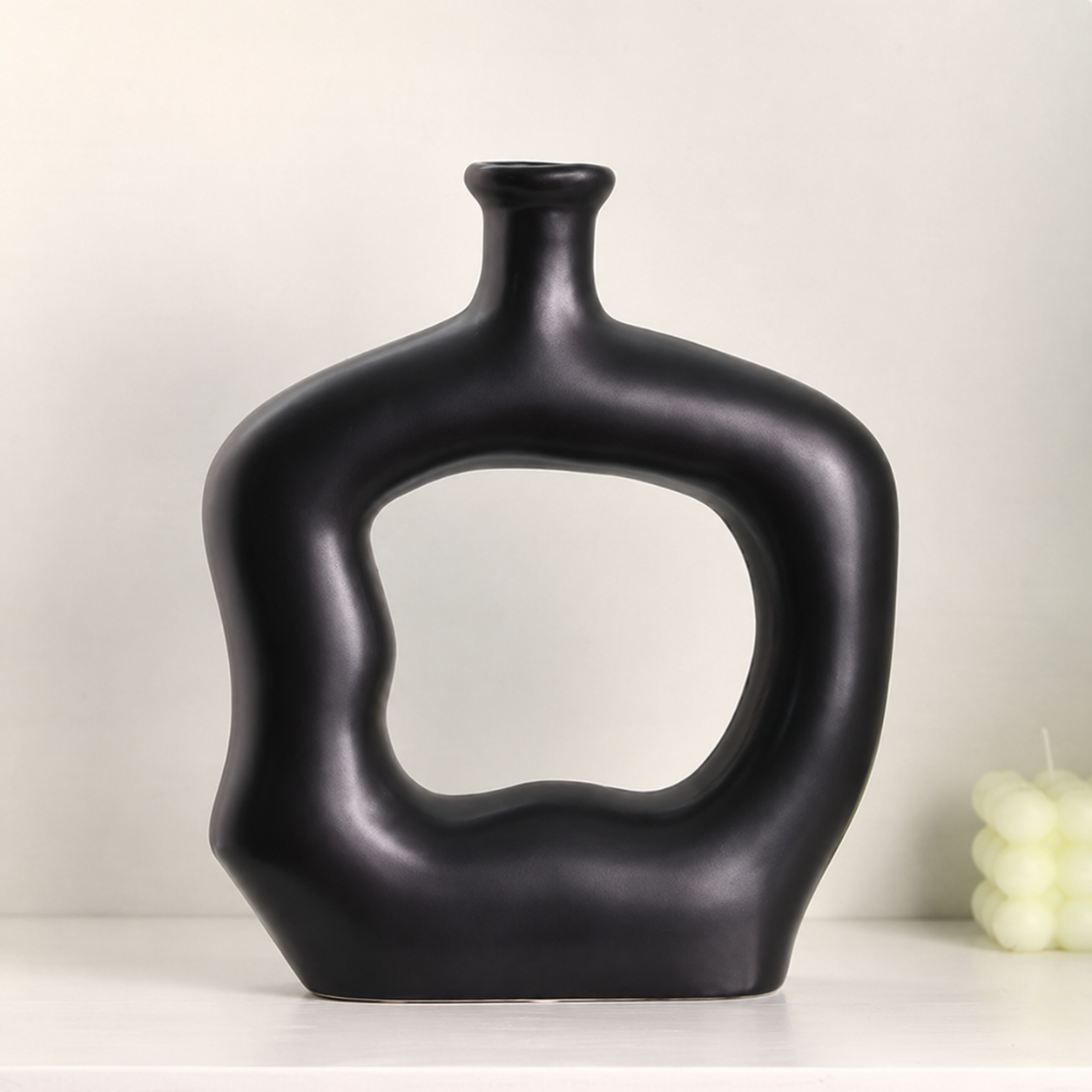 Matte black abstract hollow ceramic vase 