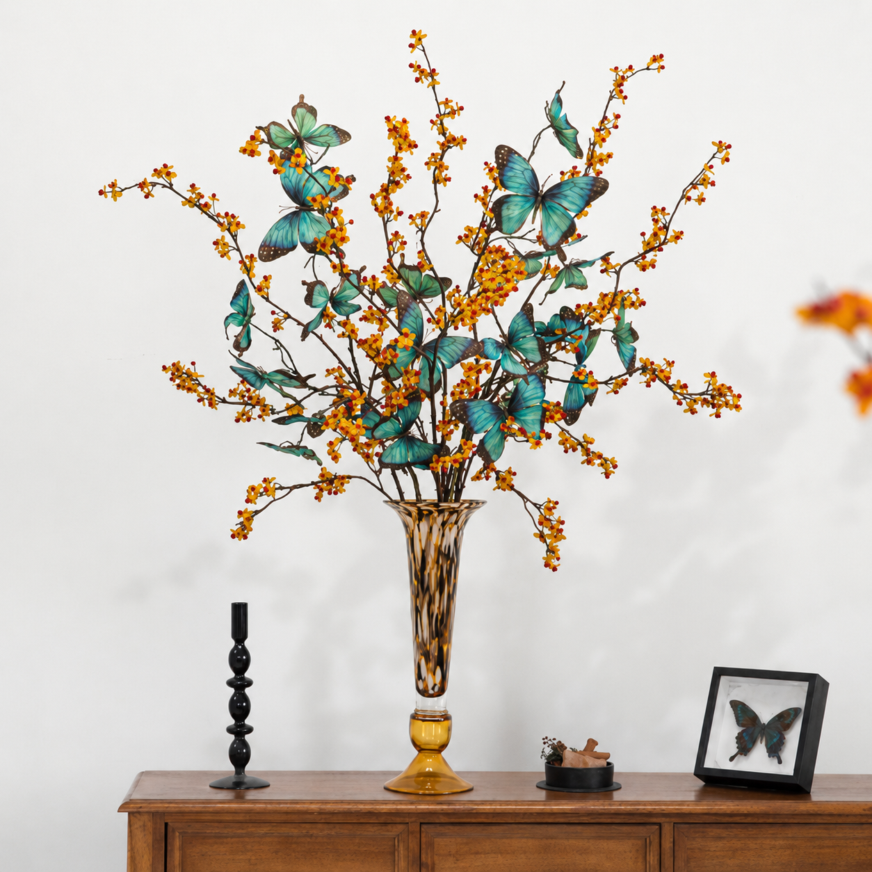 Amber glass vase with butterfly floral arrangement for elegant table decor