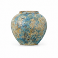 Small round blue gold textured ceramic decorative vase on a white background
