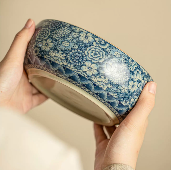 Blue floral ceramic serving bowl close-up showing detailed exterior pattern