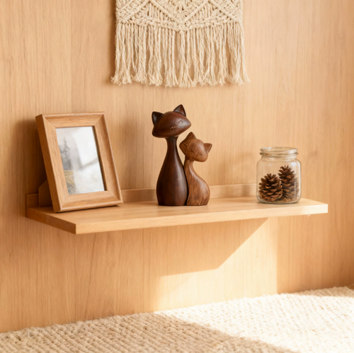Cat couple figurine styled on wooden shelf with cozy neutral home decor
