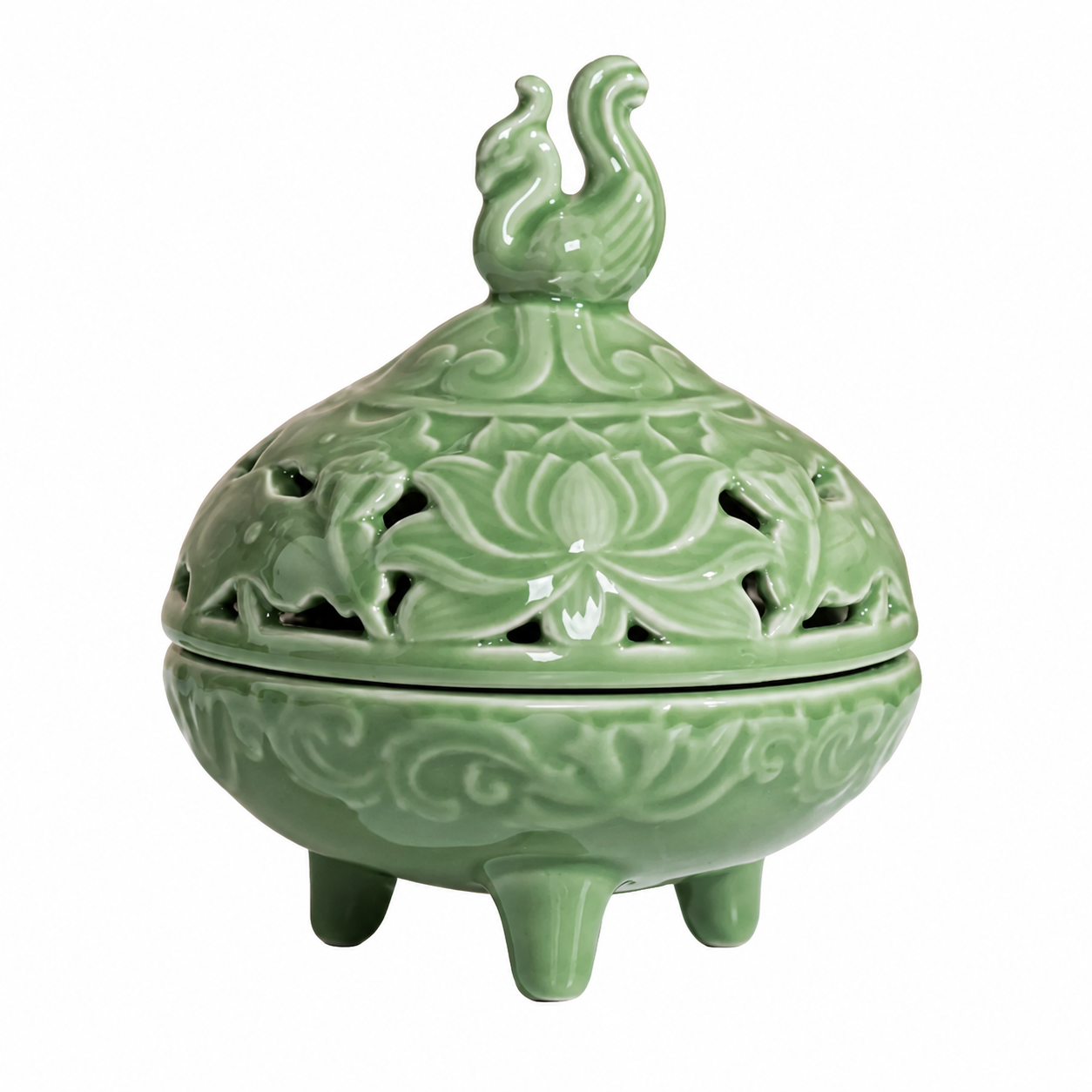 Round celadon green ceramic incense burner with pierced lid and phoenix finial on white background