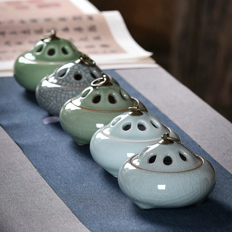 Ceramic incense burners in five glazed color finishes with ventilated lids