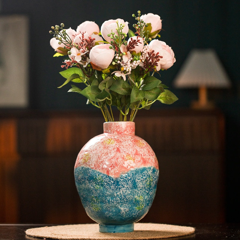 Colorful ceramic vase with pink flowers for modern table decor