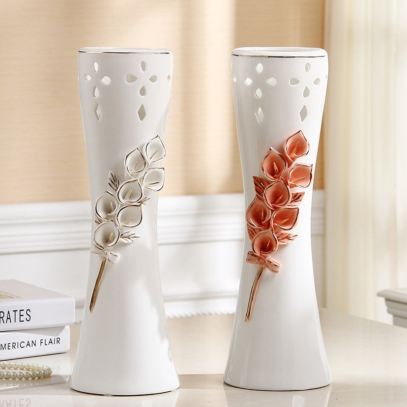 White ceramic flower vases with 3D floral relief in pink and white variants