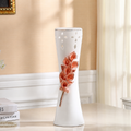 Medium pink flower ceramic vase with cutout detailing and flared silhouette
