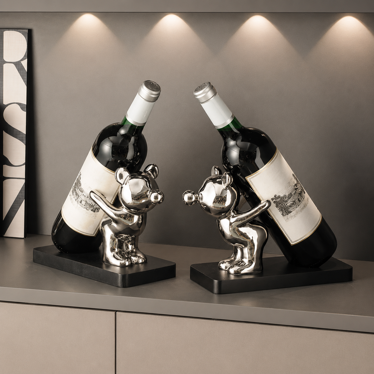Silver and gold animal ceramic wine bottle holders displayed together with wine bottles on black wood bases