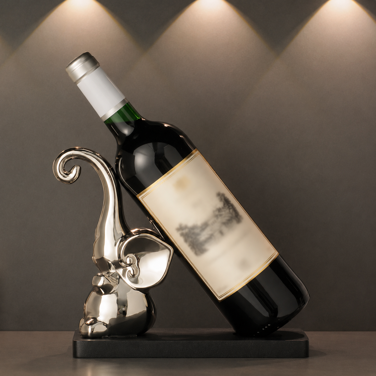 Silver elephant ceramic wine bottle holder with wine bottle on black wood base