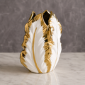 Medium gold electroplated ceramic plantain leaf vase displayed on a tabletop