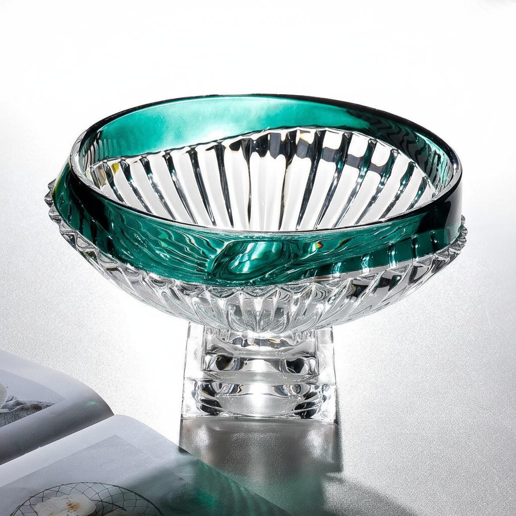Front view of emerald green fluted glass pedestal bowl showing sculptural base