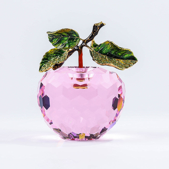 Pink faceted crystal apple decor with green enamel leaves and reflective crystal finish
