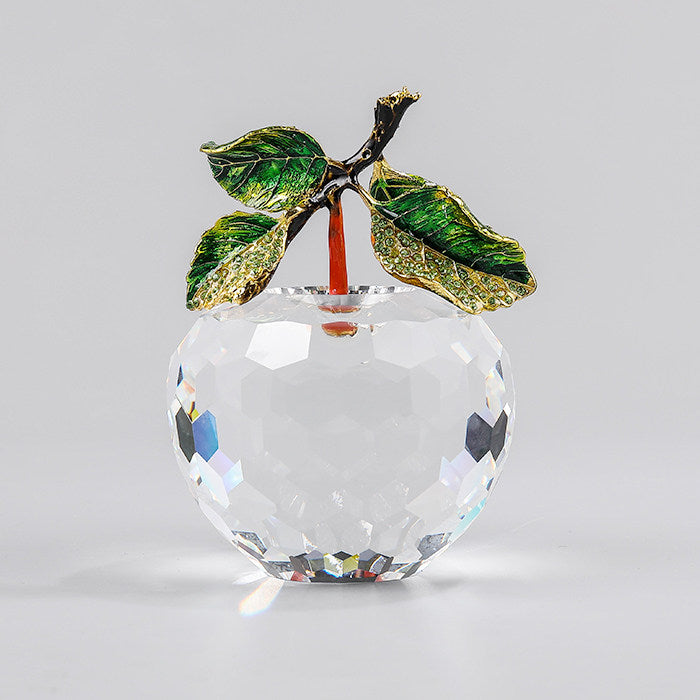 Clear faceted crystal apple decor with green enamel leaves and gold-tone accents