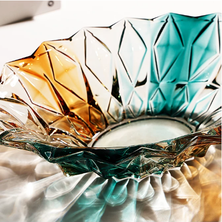 Top view of faceted gradient glass centerpiece bowl with teal amber and clear glass finish