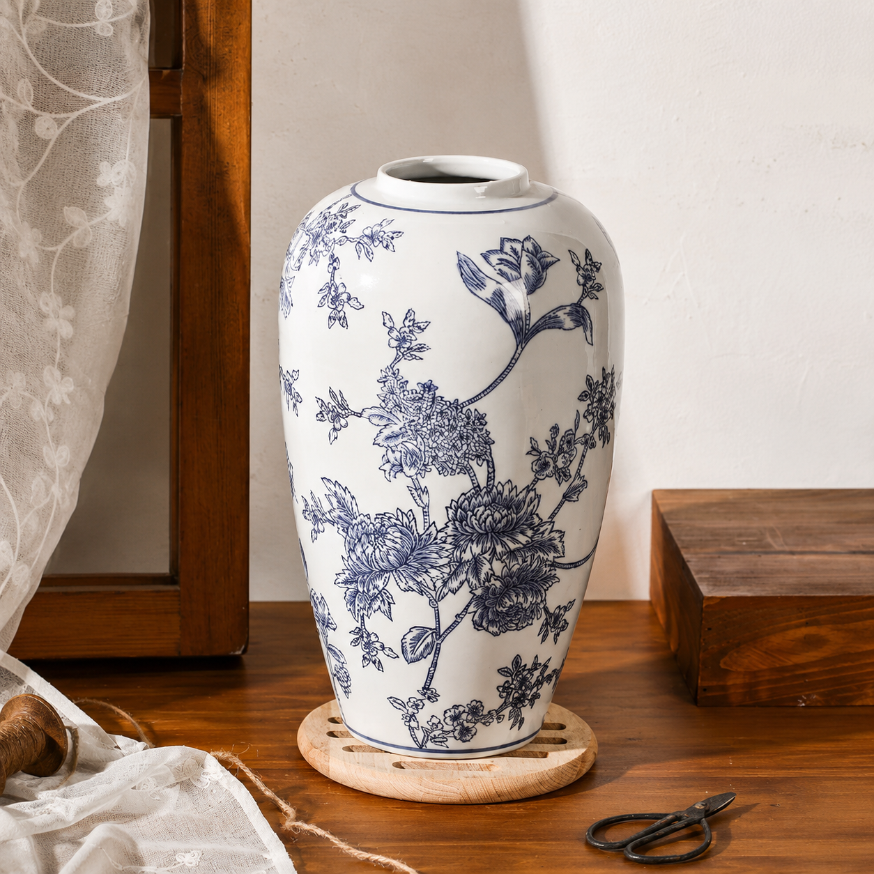 Blue floral ceramic decorative vase with classic porcelain-inspired pattern
