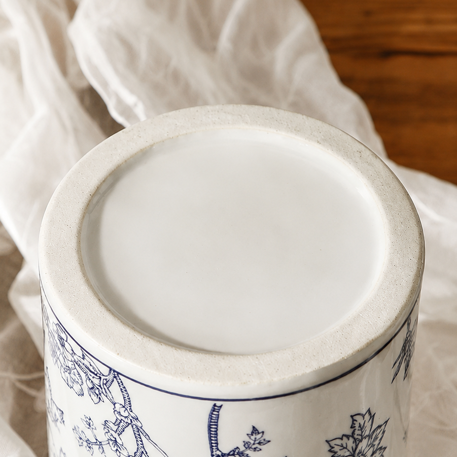 Close-up of the bottom or base of a blue floral ceramic decorative vase