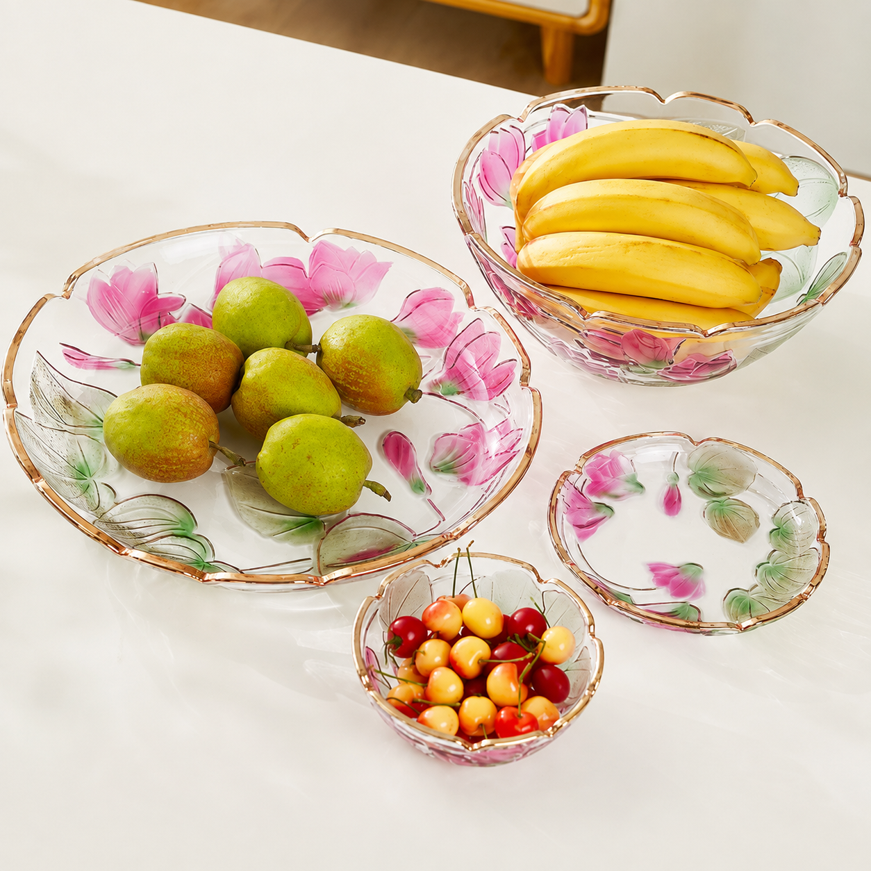 Floral embossed glass centerpiece bowl and plate collection styled with pears bananas and cherries