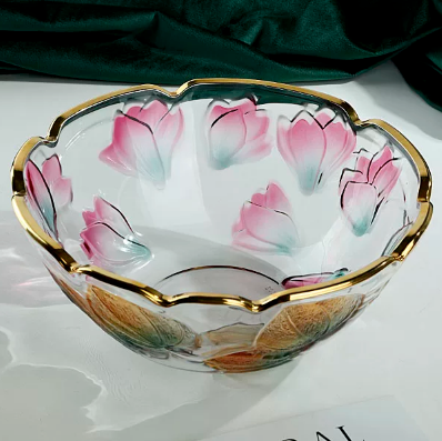 Empty floral embossed glass centerpiece bowl with pink flowers and gold rim