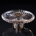 Coffee fluted glass pedestal centerpiece bowl displayed against a dark background