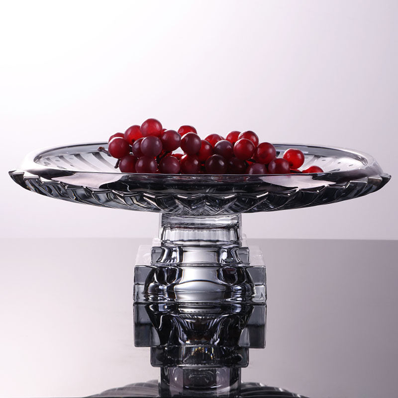 Side view of clear glass pedestal centerpiece bowl showing raised geometric base