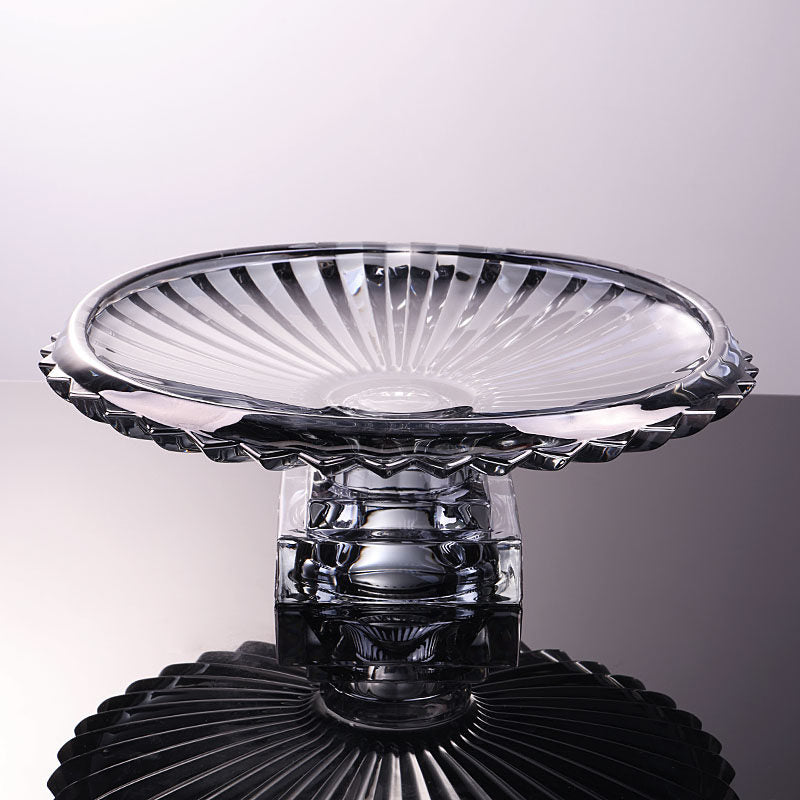 Gray fluted glass pedestal centerpiece bowl shown from a low side angle