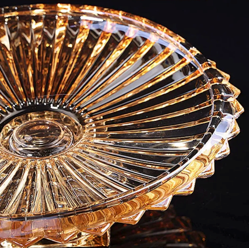 Close up of amber fluted glass bowl showing radiating ribbed texture