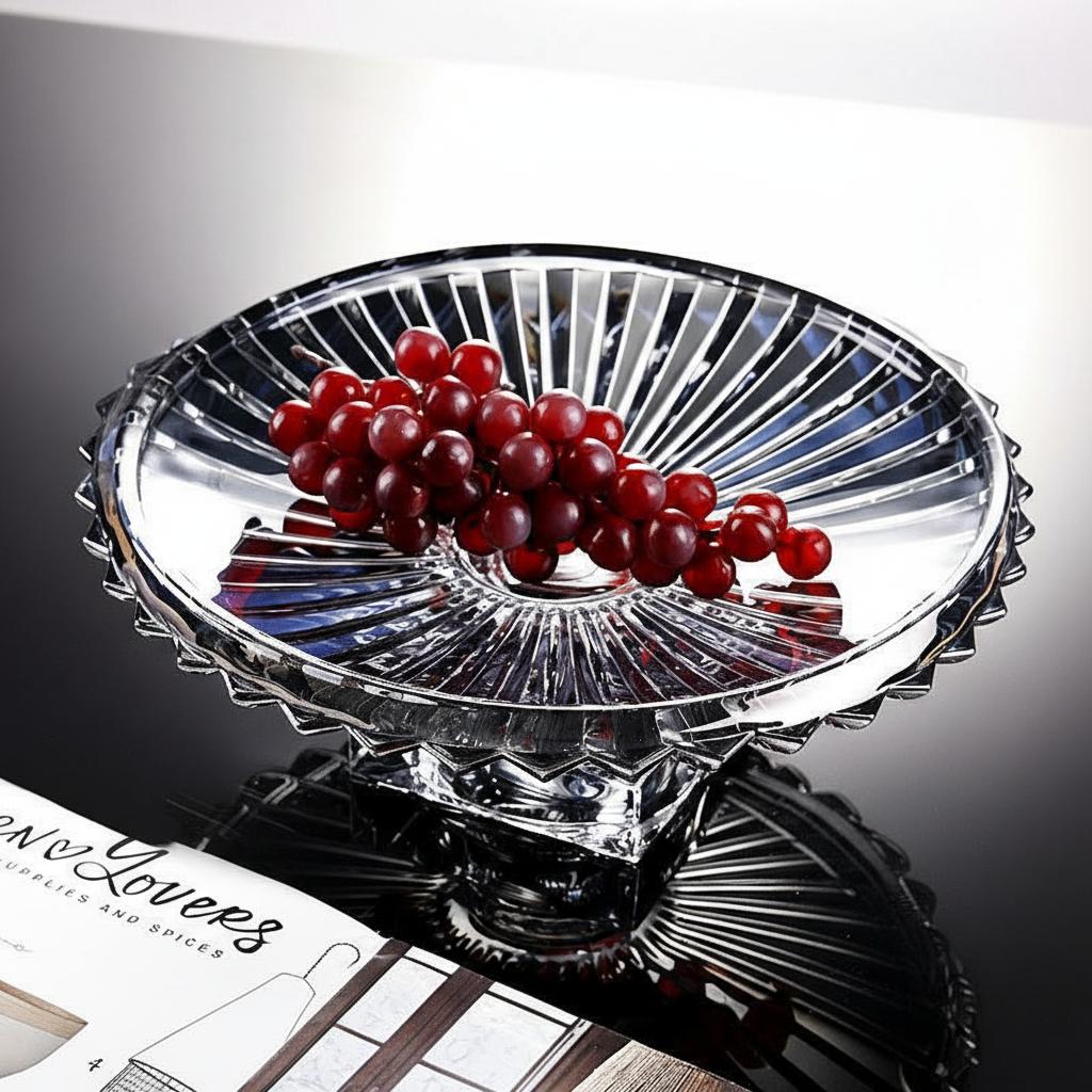 Clear fluted glass pedestal centerpiece bowl filled with red berries