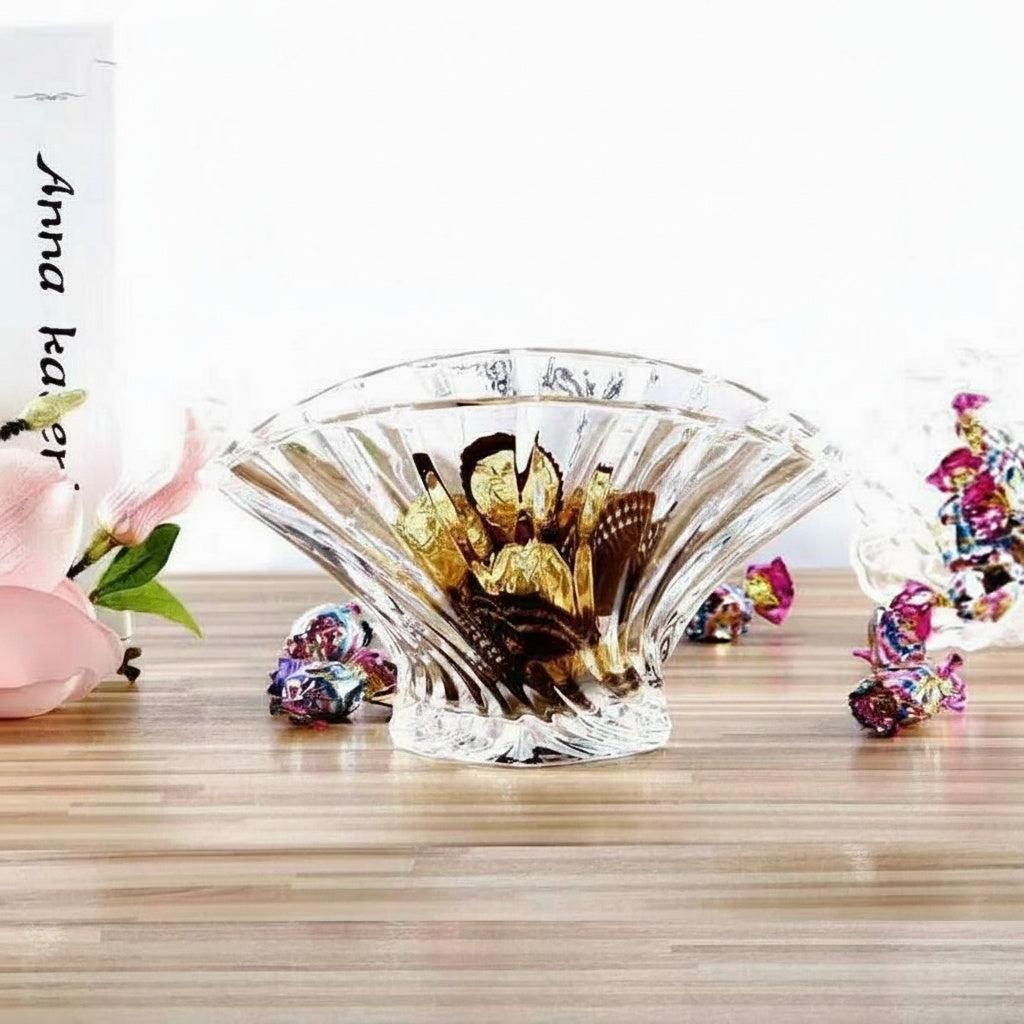 Clear fluted glass serving centerpiece bowl styled on a modern tabletop