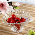 Clear fluted glass centerpiece bowl filled with red cherries