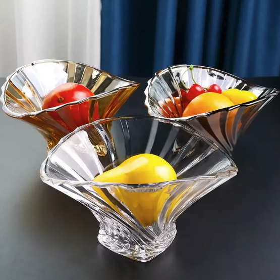 Fluted glass centerpiece bowls styled with colorful fruit in a decorative display
