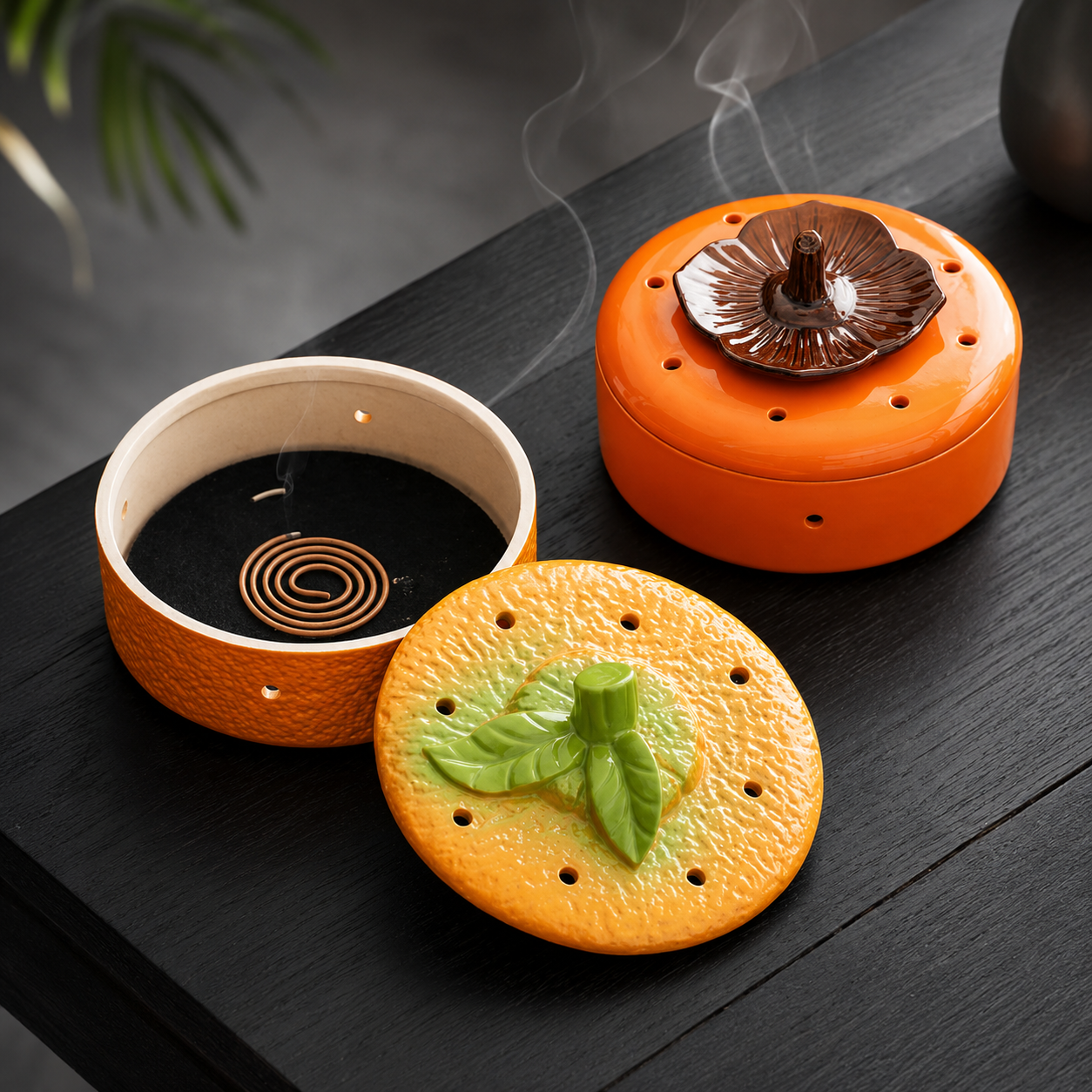 Ceramic incense burner with coil holder and fruit-inspired orange and persimmon lid designs