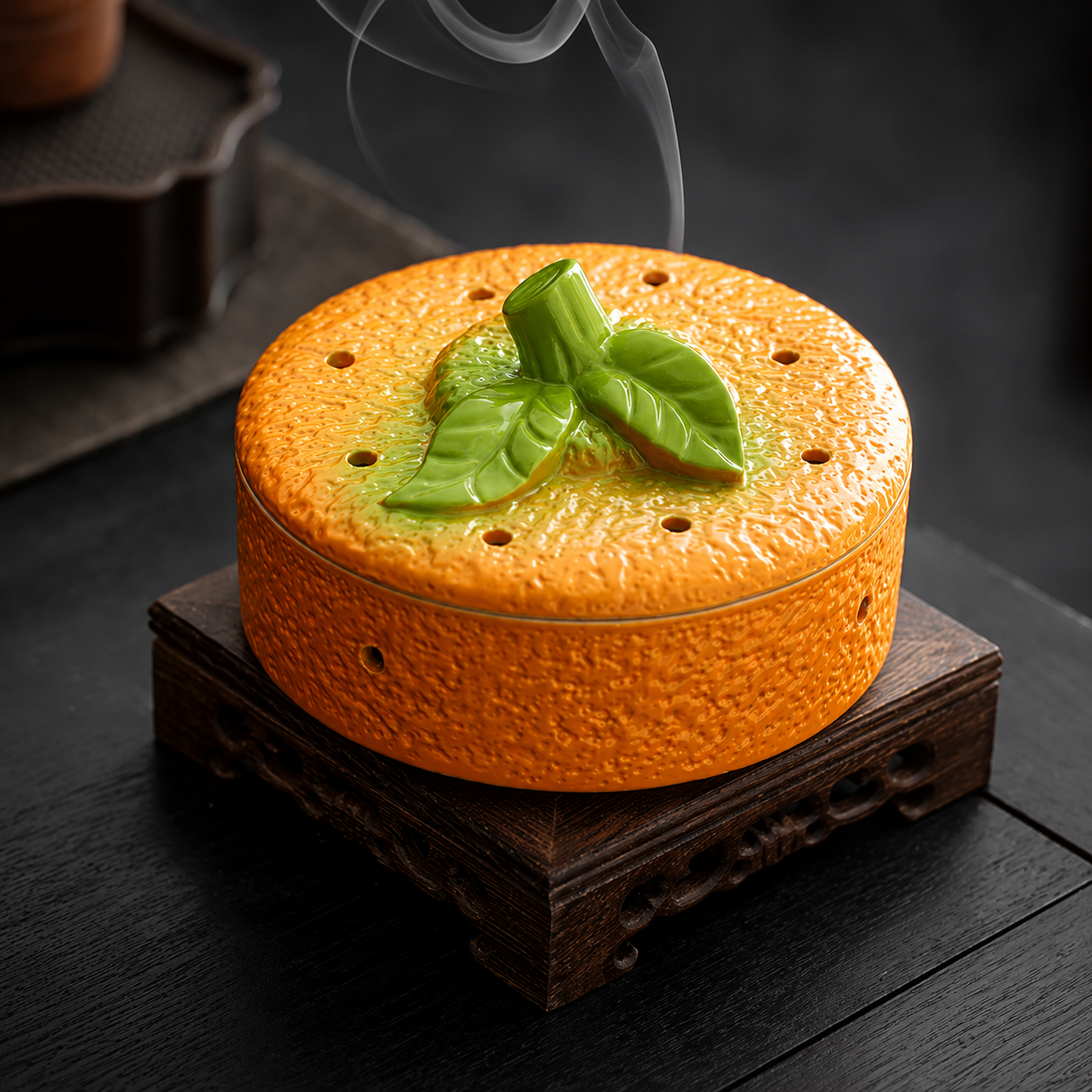Persimmon ceramic incense burner on wooden stand with soft smoke for calming home fragrance decor