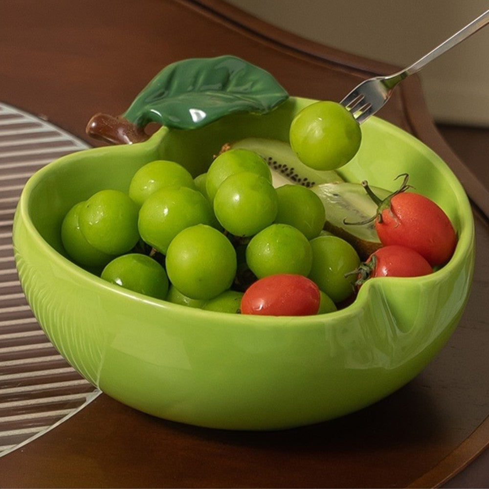 Green apple ceramic serving bowl filled with grapes kiwis and cherry tomatoes