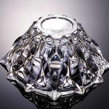 Bottom view of faceted glass bowl showing geometric petal inspired glass pattern