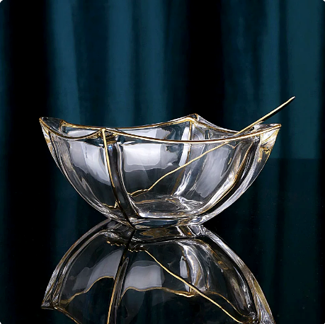 Front angled view of gold rimmed wavy glass centerpiece bowl