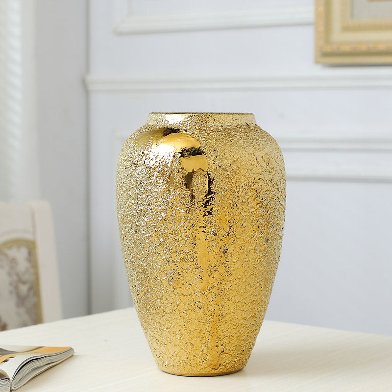 Medium gold tone ceramic vase with reflective textured finish