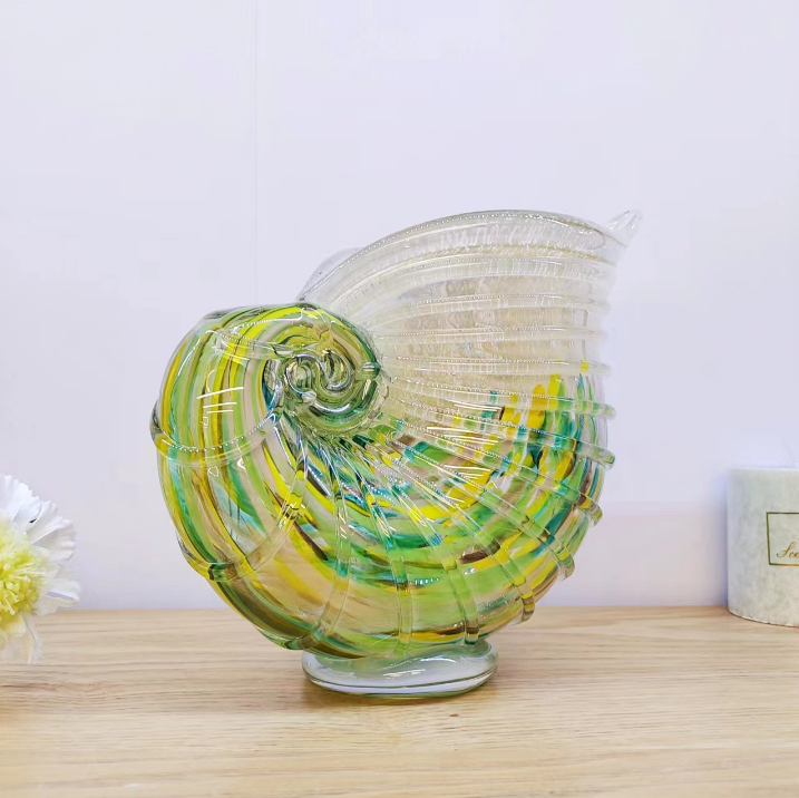 Green and amber shell shaped art glass vase for shelf and table display