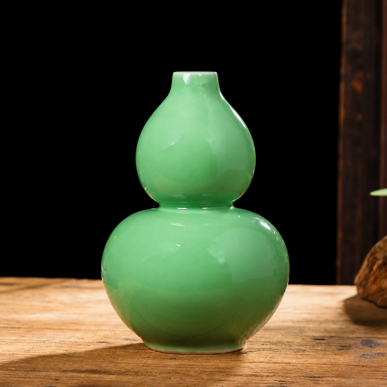 Gourd shaped green ceramic vase with stacked rounded silhouette