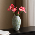 Slim green speckled ceramic vase with red flowers for table decor