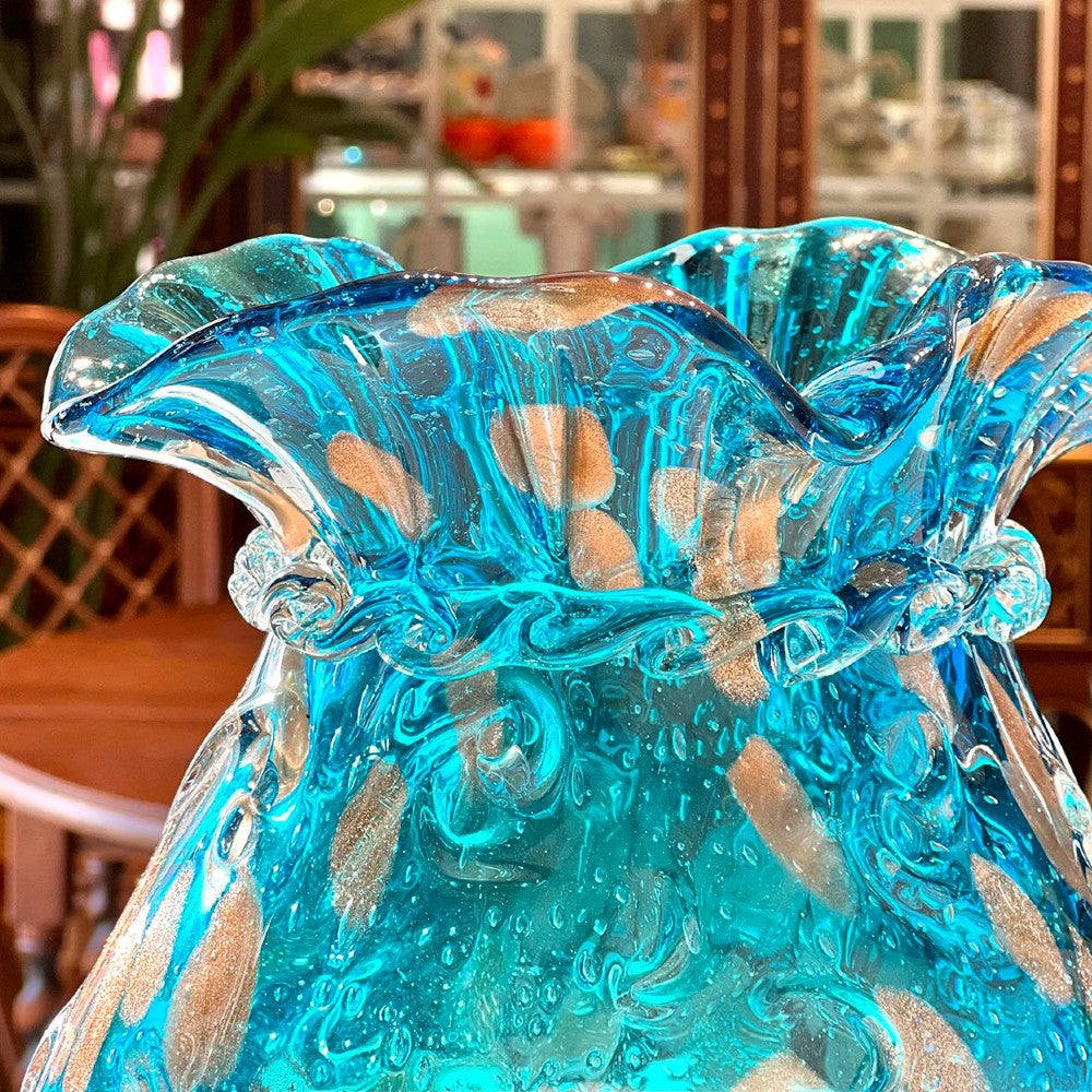 Top view of hand blown blue art glass vase with ruffled rim