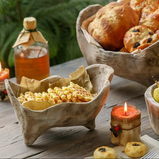 Handmade wooden footed bowls styled with baked goods and rustic tabletop decor