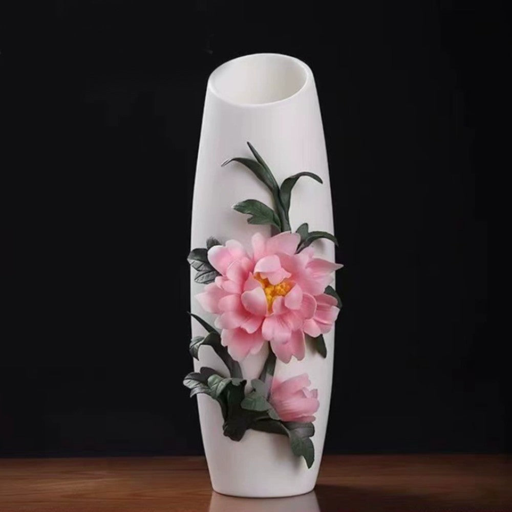 elegant white ceramic vase with floral relief design displayed as luxury home decor