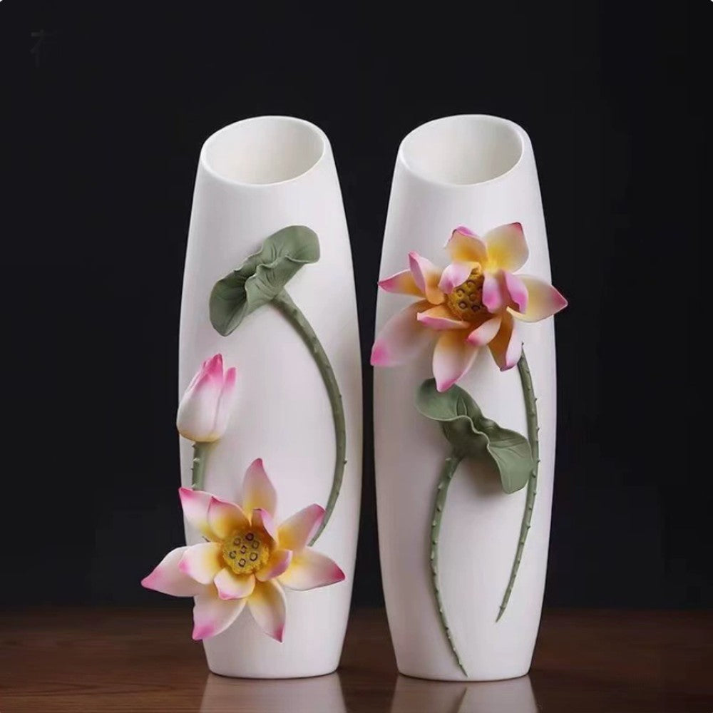 set of white ceramic floral relief vases featuring peony and lotus designs side by side