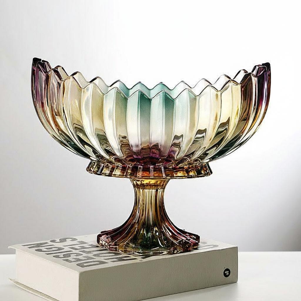 Iridescent footed glass centerpiece bowl with a scalloped rim displayed on stacked books
