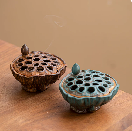 Rustic Brown and Patina Teal lotus pod ceramic incense burners on wooden table