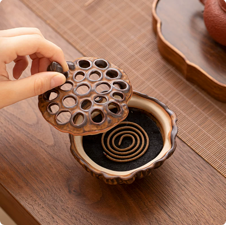 Rustic Brown lotus pod incense burner open with incense coil inside