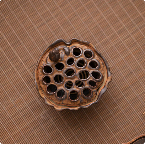 Top view of Rustic Brown lotus pod incense burner with pierced ceramic lid