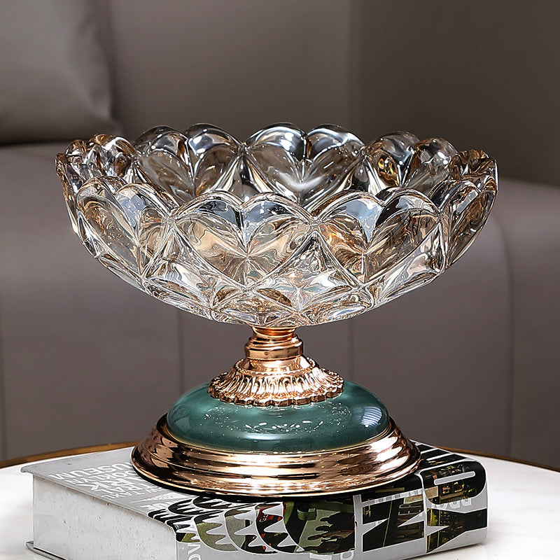 Crystal petal glass pedestal centerpiece bowl displayed on decorative books